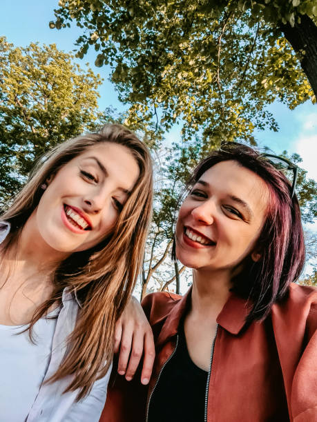 istock Smiling women making selfie together 1320379397