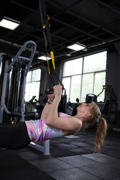 istock Sportswoman exercising at the gym 1320384338