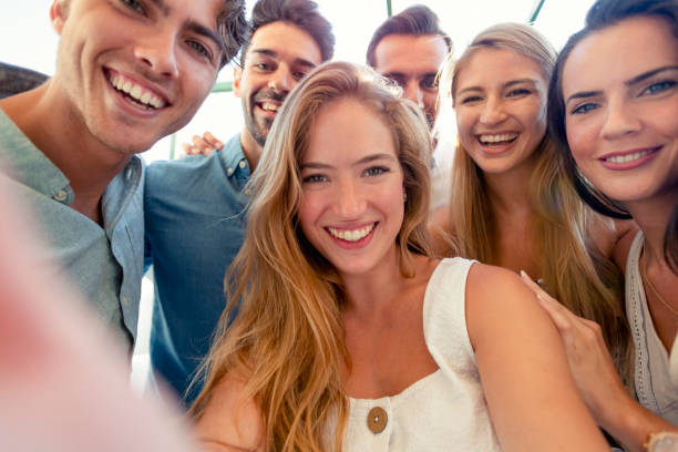 istock Group of friends taking a selfie laughing and smiling. 1320385215