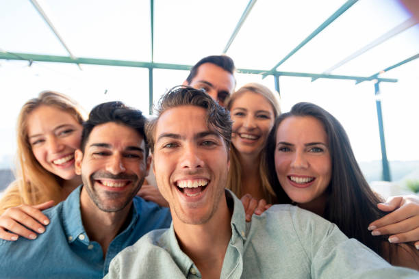 istock Group of friends taking a selfie laughing and smiling. 1320385219