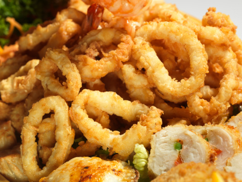 close up picture of mixed fried seafood on white background (this picture has been taken with a Hasselblad H3D II 31 megapixels camera)