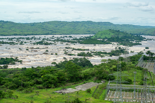 Inga Falls, Democratic Republic of Congo - December 09, 2014: The complex of the Inga Dams, two hydroelectric dams connected to one of the largest waterfalls in the world, Inga Falls (former Livingstone Falls). They are located in the western Democratic Republic of the Congo and 140 miles southwest of Kinshasa. the Inga dam is Africas largest power plant and there are currently plans to build a third Inga dam, which would make the complex to the world's largest hydroelectric project.