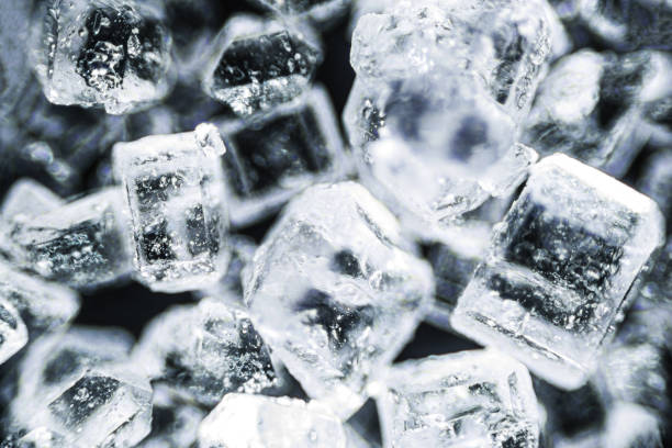 istock Crystal sugar macro on black background under the light microscope, magnification of 40 times, microscope objective 4 1320388263