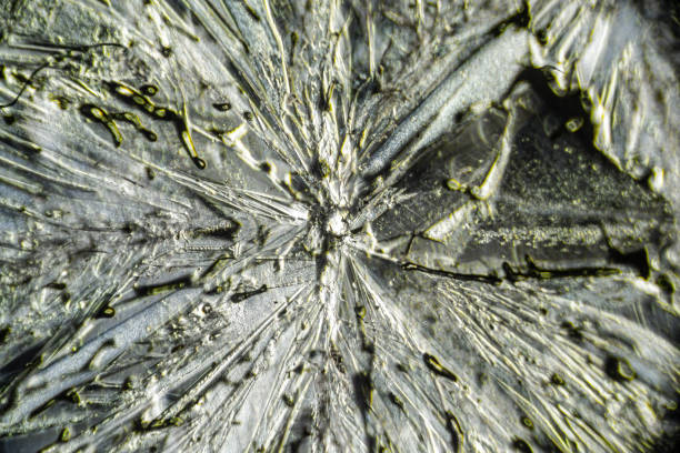 Salt crystal macro close up under the light microscope, magnification of 100 times, microscope objective 10