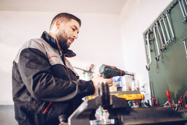 istock The service mechanic works with the tools in the workshop 1320388559