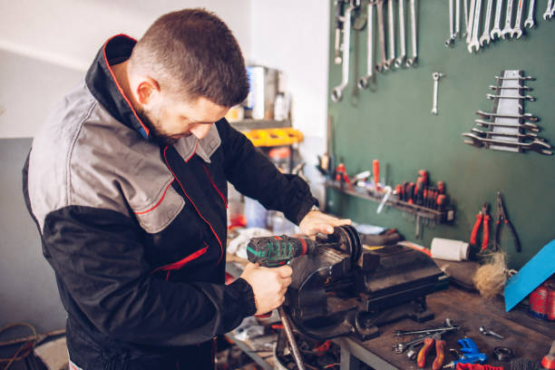 istock The service mechanic works with the tools in the workshop 1320388617