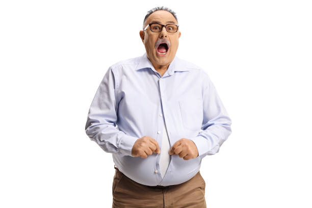 Shocked man with a big belly trying to button a shirt Shocked man with a big belly trying to button a shirt isolated on white background chubby arab stock pictures, royalty-free photos & images