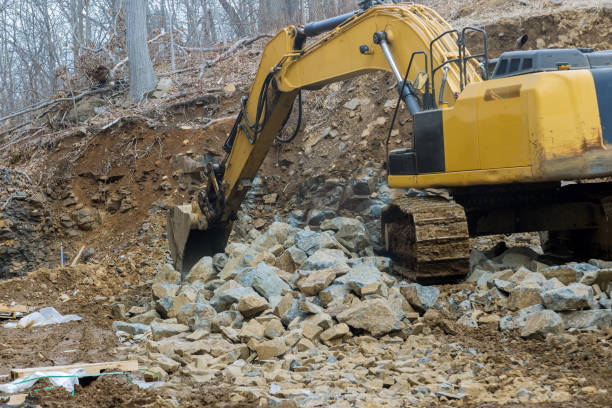 istock A large powerful loader overloads a pile of crawler excavator pours stones 1320389486