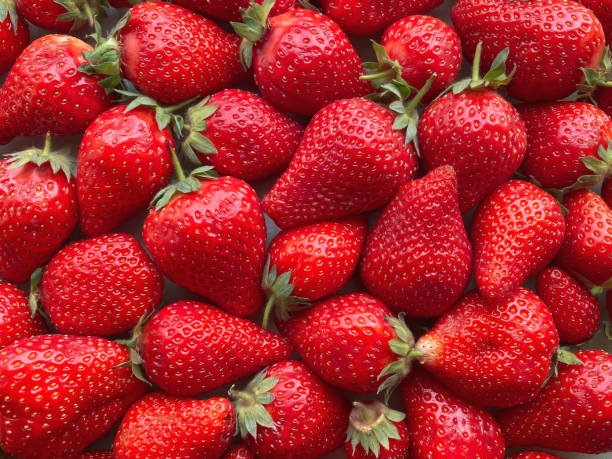 istock Flatlay from a large number of strawberries. Natural background. 1320389704