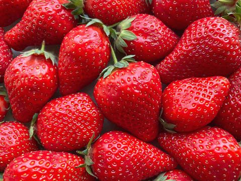 Close-up of a large number of strawberries. Natural background