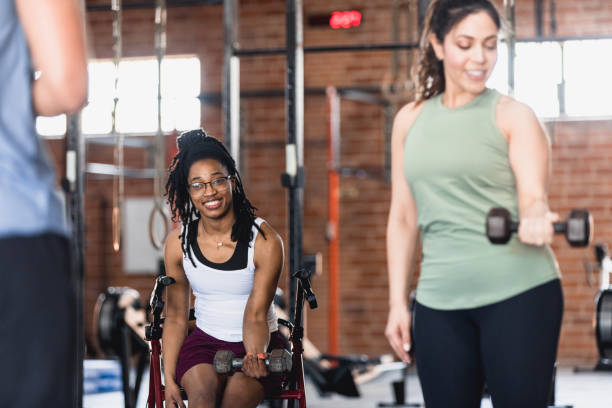 istock Diverse women work biceps with dumbbell 1320391305