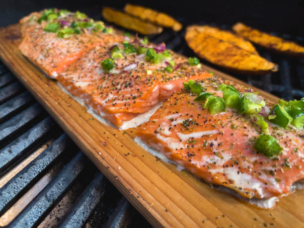 istock BBQ Grilled Salmon Files on Cedar Plank Photo Series 1320391409