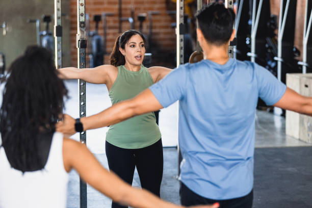 istock Female fitness instructor leads class 1320392550