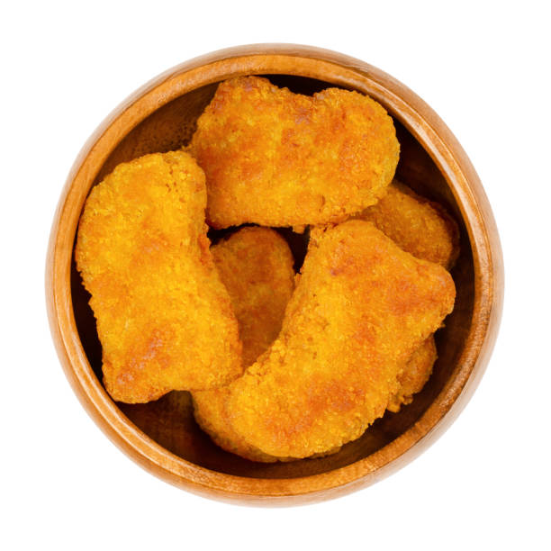 istock Deep-fried vegan nuggets based on soy and wheat protein, in wooden bowl 1320394364