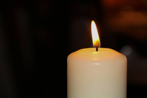 istock Burning paraffin light close up on dark background 1320395240