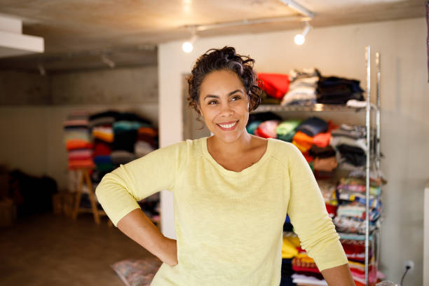 istock Portrait of smiling seamstress in her sewing studio 1320400812