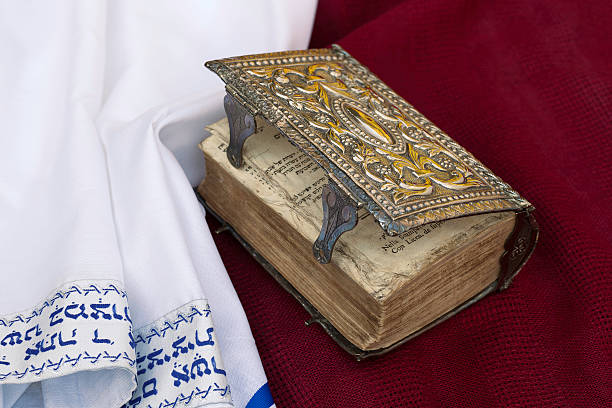 istock Antique Prayer Book and Tallit On A Purple Background 132040197