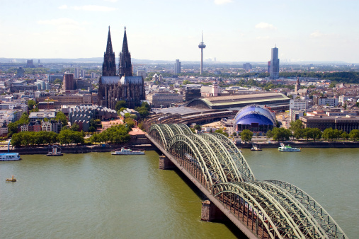 Cologne Cathedral is a famous monument of German Catholicism and Gothic architecture and a symbol of Germany.  Hohenzollern Bridge is one of the most important railway junctions in Europe