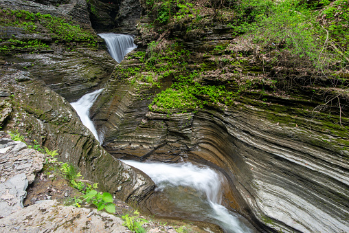 Waterfalls running through narrow gorge at Watkins Glen State Park, Finger Lakes Region, New York, USA