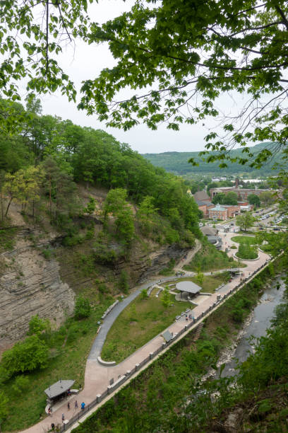The main entrance at Watkins Glen State Park with view of Village of Watkins Glen The main entrance at Watkins Glen State Park with view of Village of Watkins Glen, Finger Lakes Region, New York, USA watkins glen stock pictures, royalty-free photos & images