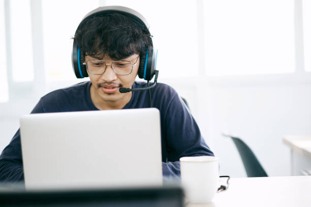 istock Service Desk Consultant Talking on hands-free phone. Call center 1320412351