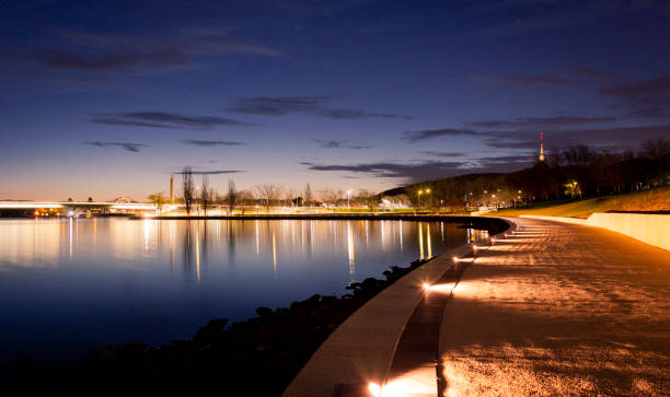 Lake Burley Griffin The illuminated path along the waters of Lake Burley Griffin in Canberra, Australian Capital Territory. Australia. canberra stock pictures, royalty-free photos & images