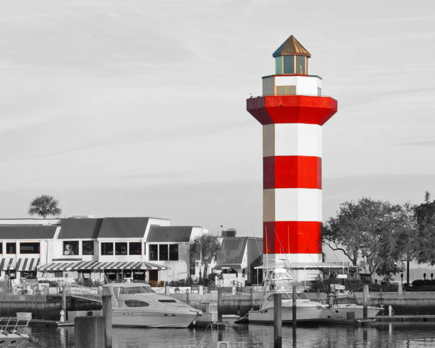 Manavgat harbour entrance and lighthouse with man fishing, bad weather