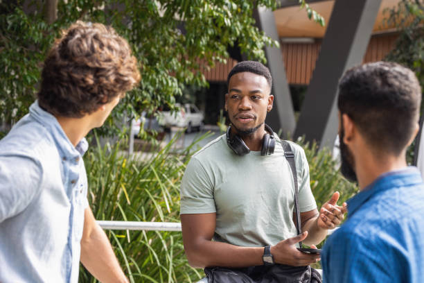 istock African-Australian Student Relaxing With Friends On Campus 1320421603