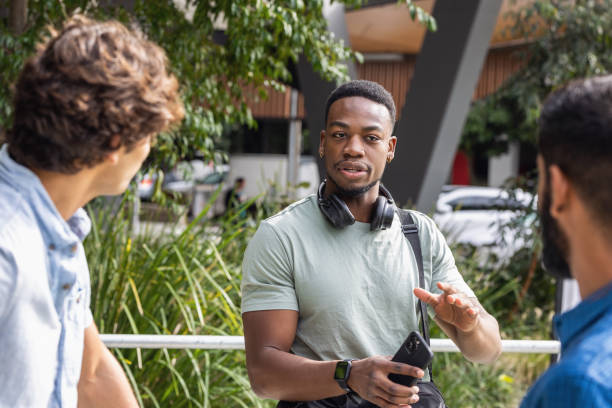 istock African-Australian Student Relaxing With Friends On Campus 1320421688