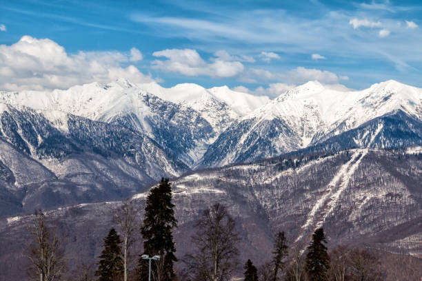istock High mountain peaks covered with snow on a clear sunny day 1320424447