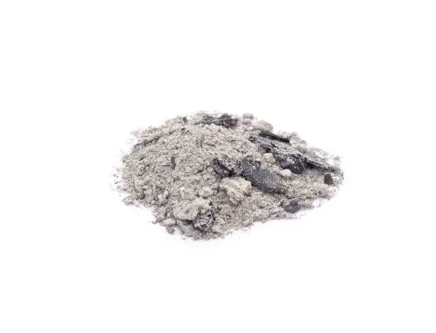 Pile of wood ashes isolated on a white background.