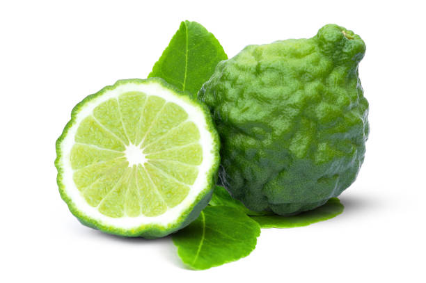 istock bergamot or kaffir lime fruit with cut in half slice and green leaf isolated on white 1320432210