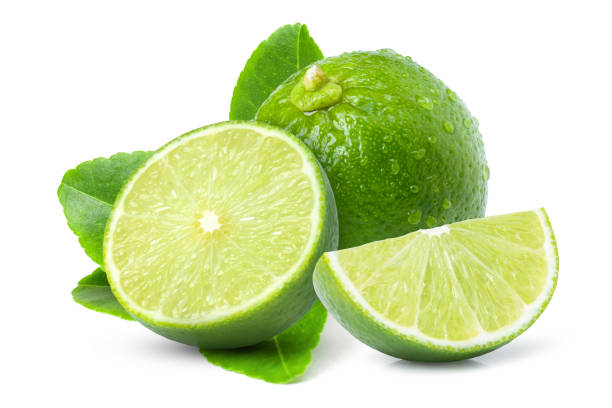 istock Fresh green lime fruit with green leaves and cut in half slice 1320432211