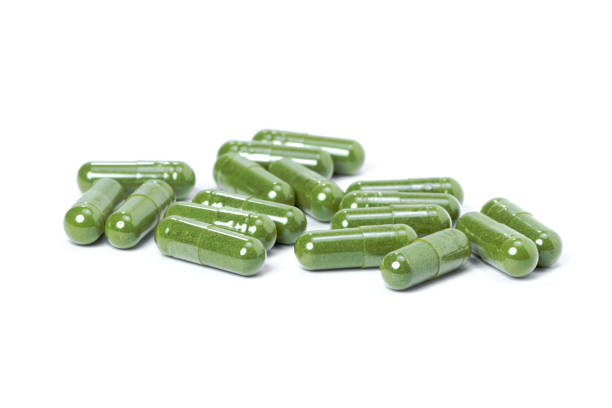 istock green herbal medicine powder capsules 1320433042