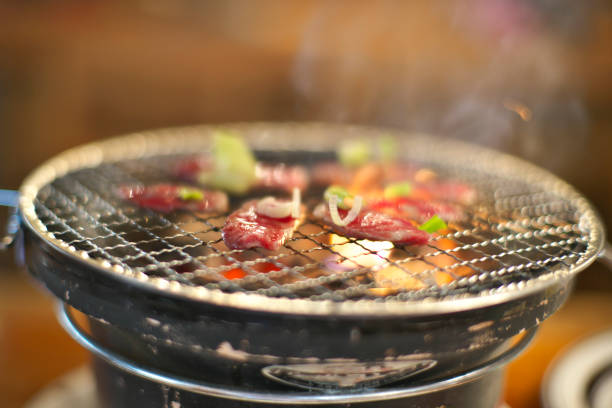 istock Broiling or grilling Japanese beef -- Wagyu Ishigaki beef -- on charcoal fire burner 1320433056