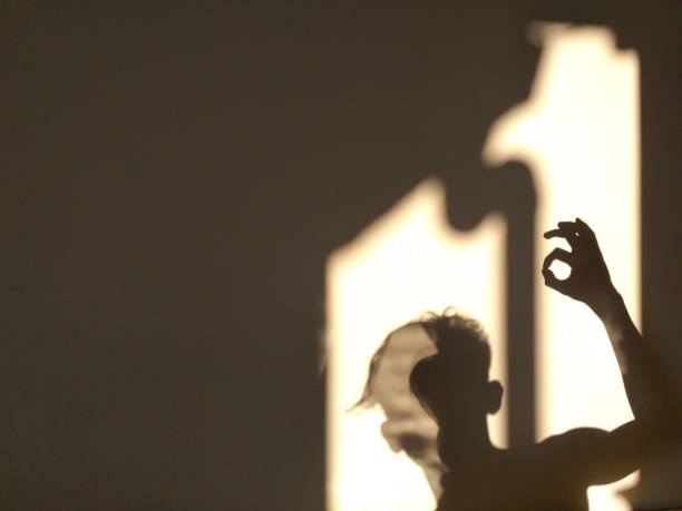 istock human shadow photo on the wall 1320433158