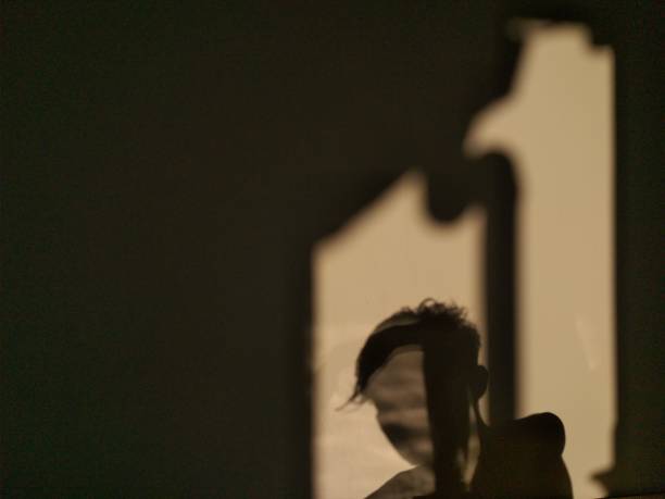 istock human shadow photo on the wall 1320433169