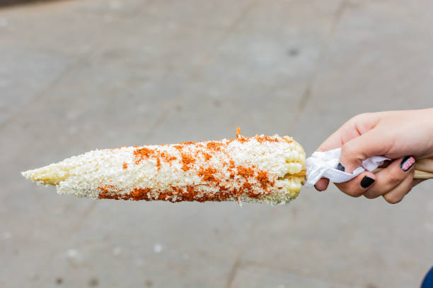 Elote with cheese and spicy.