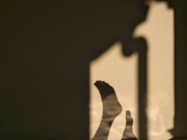 istock human shadow photo on the wall 1320433193