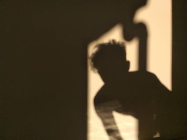 istock human shadow photo on the wall 1320433238