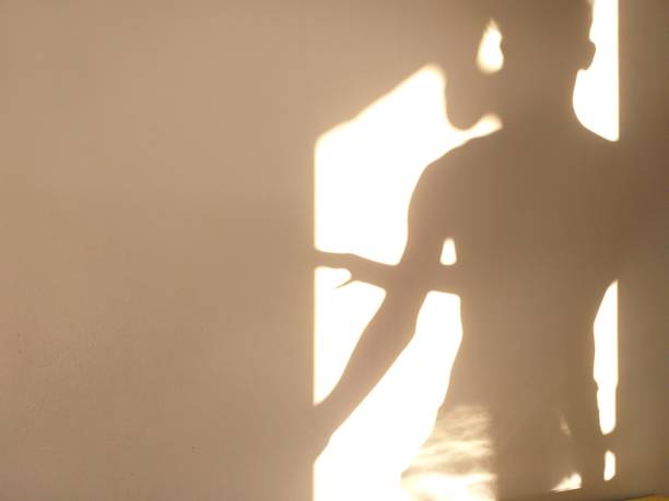 istock human shadow photo on the wall 1320433264