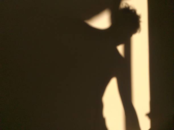 istock human shadow photo on the wall 1320433318
