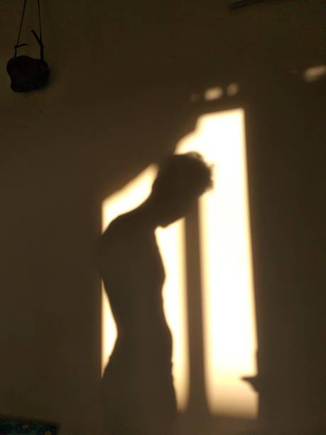 istock human shadow photo on the wall 1320433341