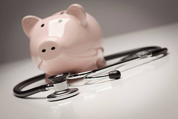 istock Piggy Bank and Stethoscope with Selective Focus 132044074