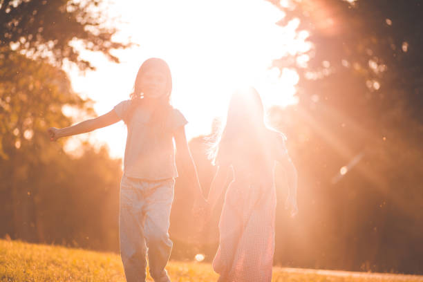 istock Two little girls spending time outside and playing. 1320444663