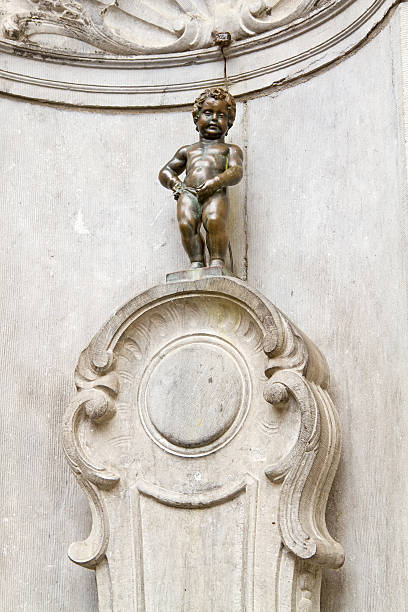 Manneken Pis of Brussels The famous statue of a pissing boy of Brussels, Belgium manneken pis statue in brussels belgium stock pictures, royalty-free photos & images