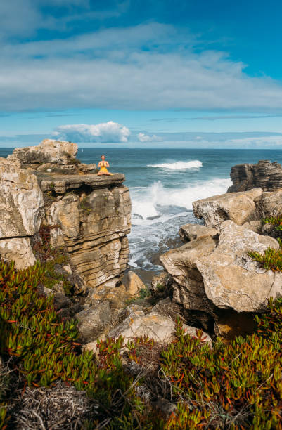 istock Ocean waves crashing against the stone shore 1320447702