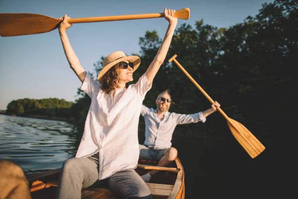 istock Couple enjoying a canoe ride 1320447772