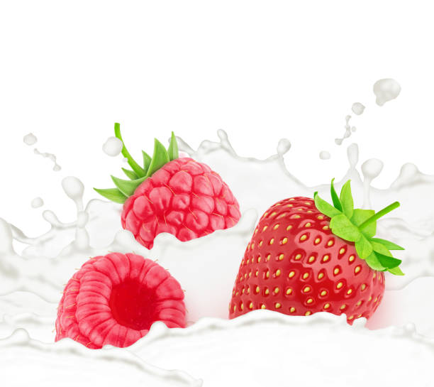 istock Strawberry and raspberry in milk splashes isolated on white background. 1320450940