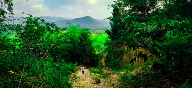 A person walking down a rocky hill